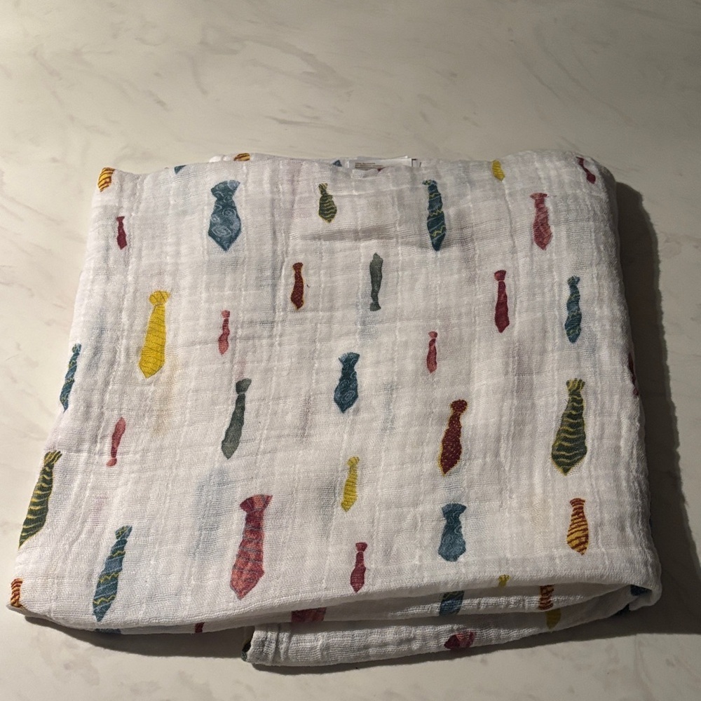 Little Unicorn Boss Baby White Muslin Swaddle with Colorful Tie Print